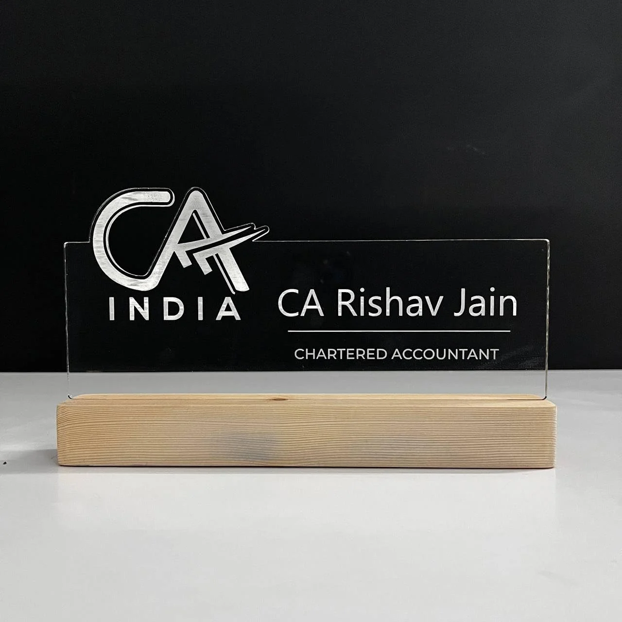 Personalised Name Lamp with Wooden Base for Chartered Accountants – 10 x 6 inch – glowing on a desk