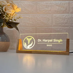 LED desk name plate for ayurveda doctors – on a desk